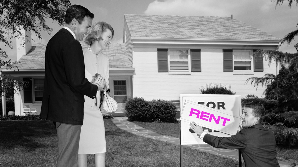 Couple standing in front of a home with a sign that has 'for sale' replaced with 'rent'